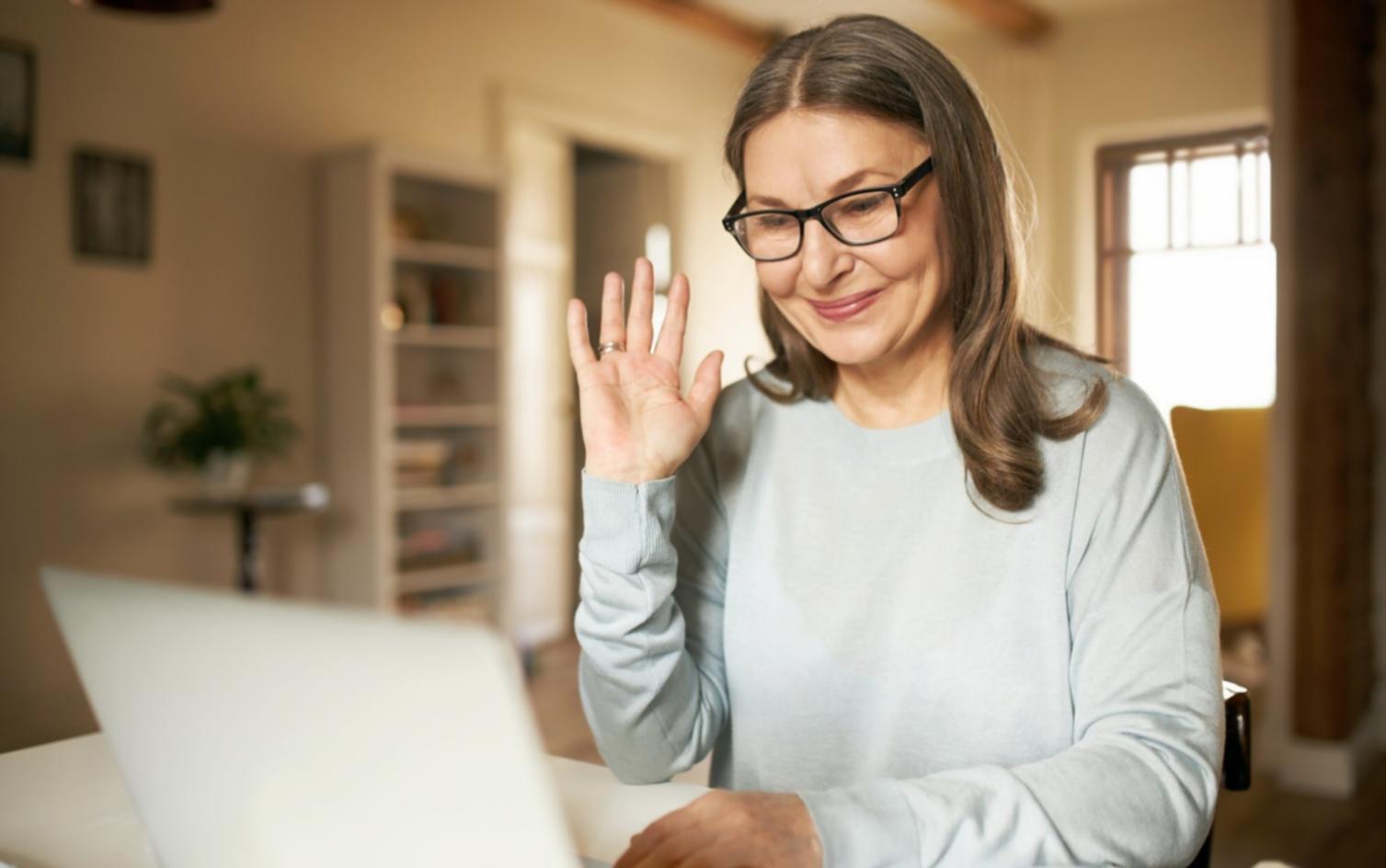 Business professional reviewing financial analysis documents with detailed charts and metrics